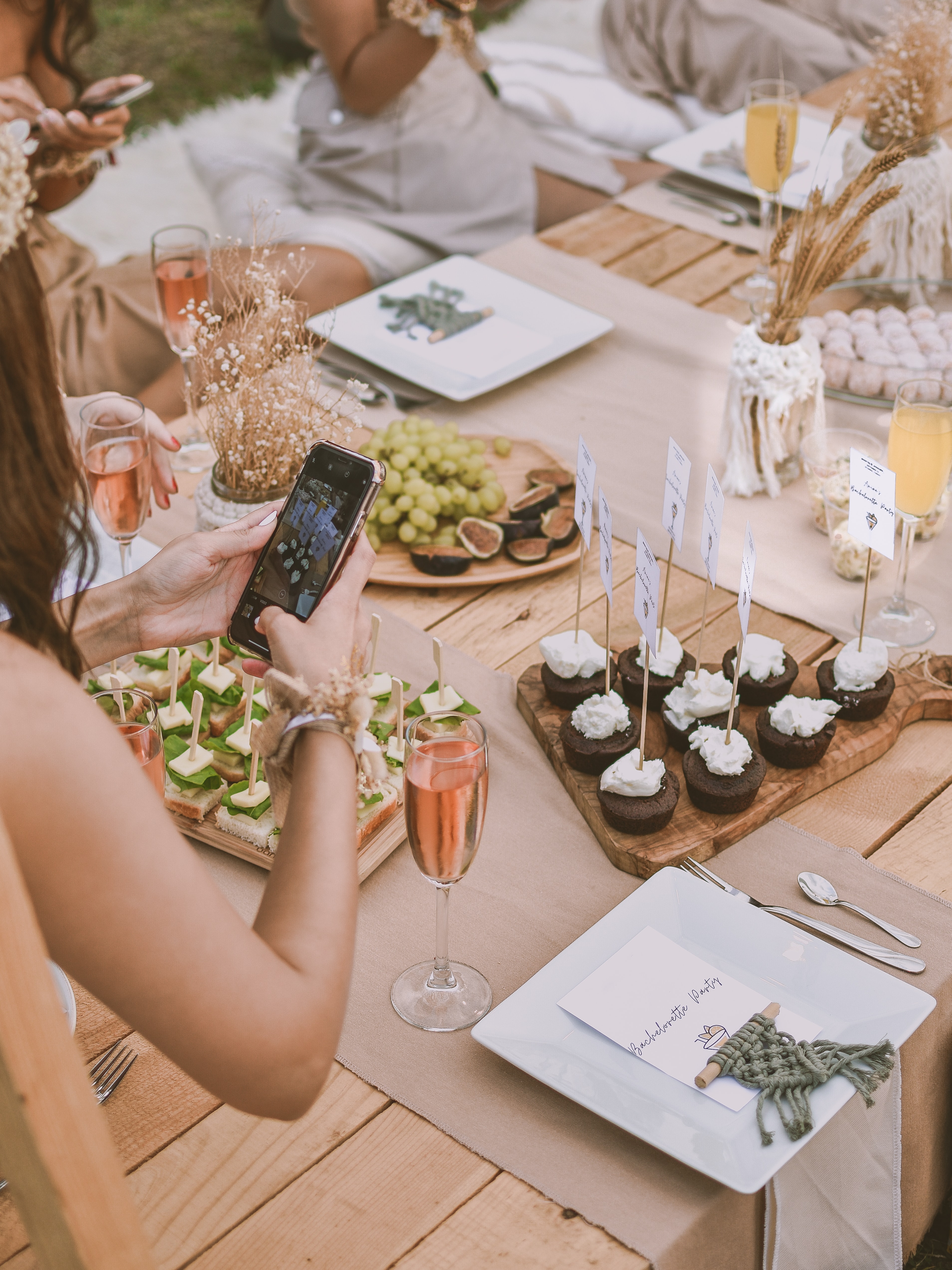 Social Media Partnerships Woman taking photo of dessert table