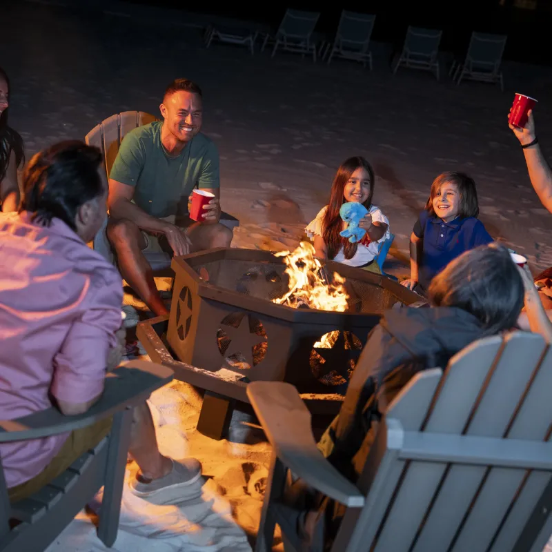 Family and Friends enjoying evening bonfire together Family and Friends enjoying evening bonfire together