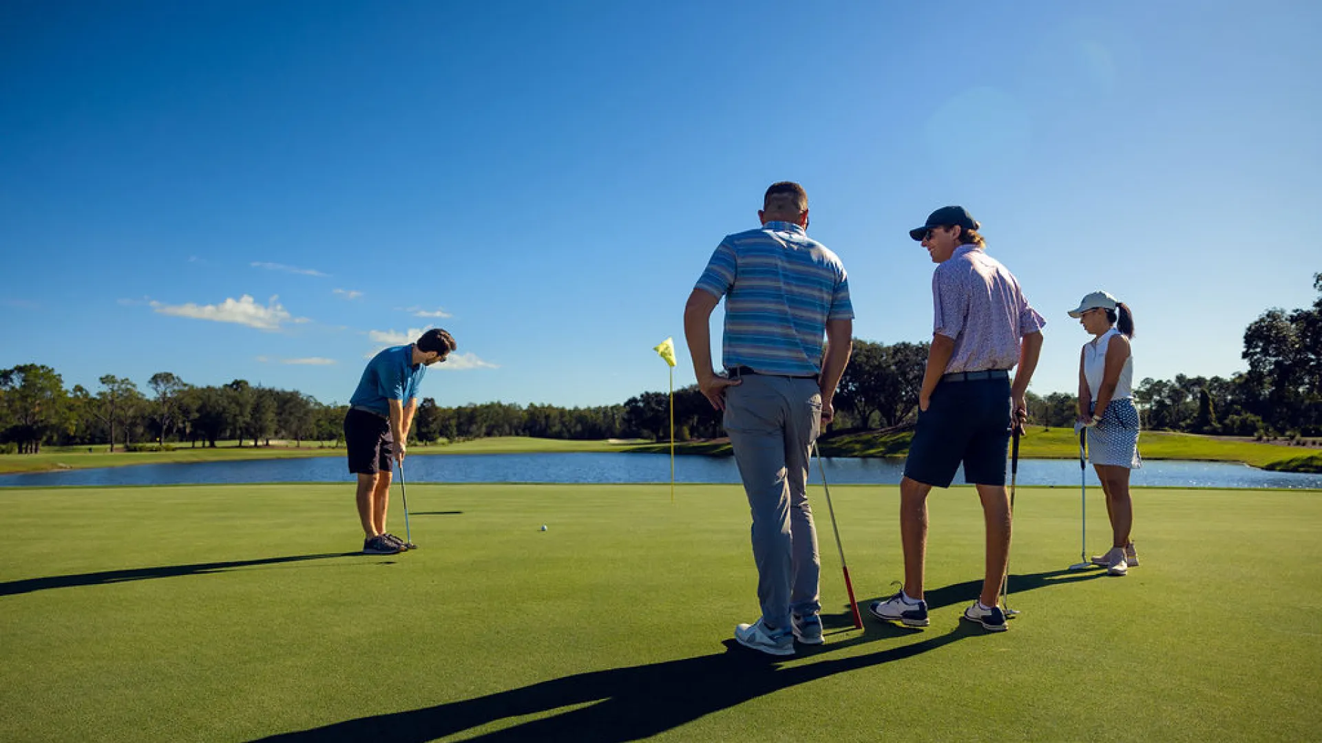 Golfers putting on Island Green