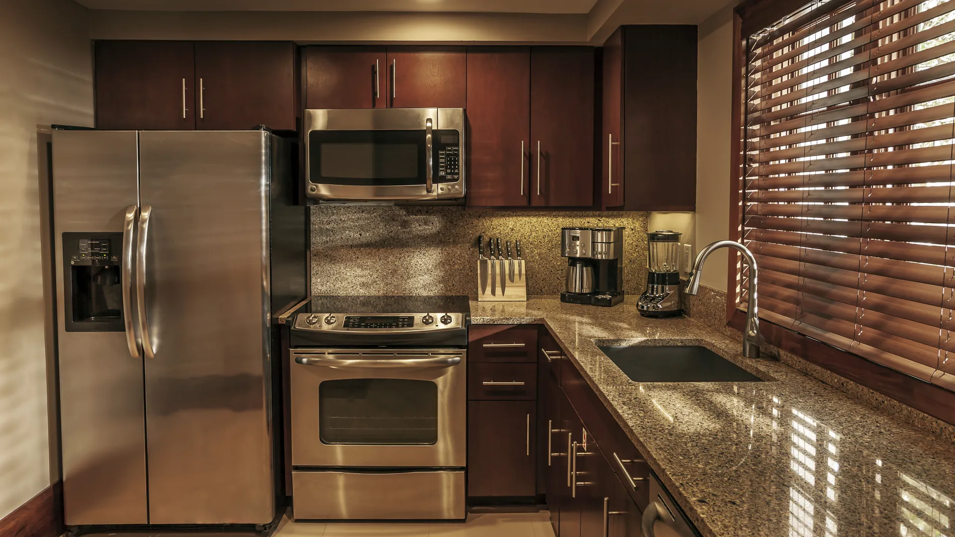 Villas kitchen interior with marble countertops and stainless steel appliances