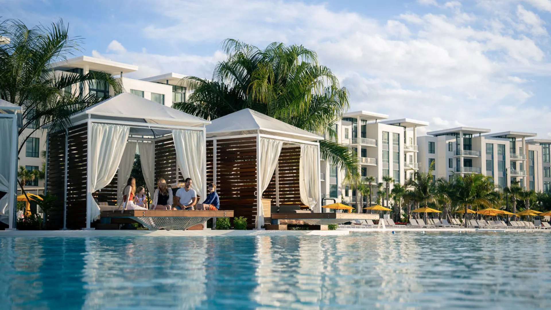 Family sitting in a cabana