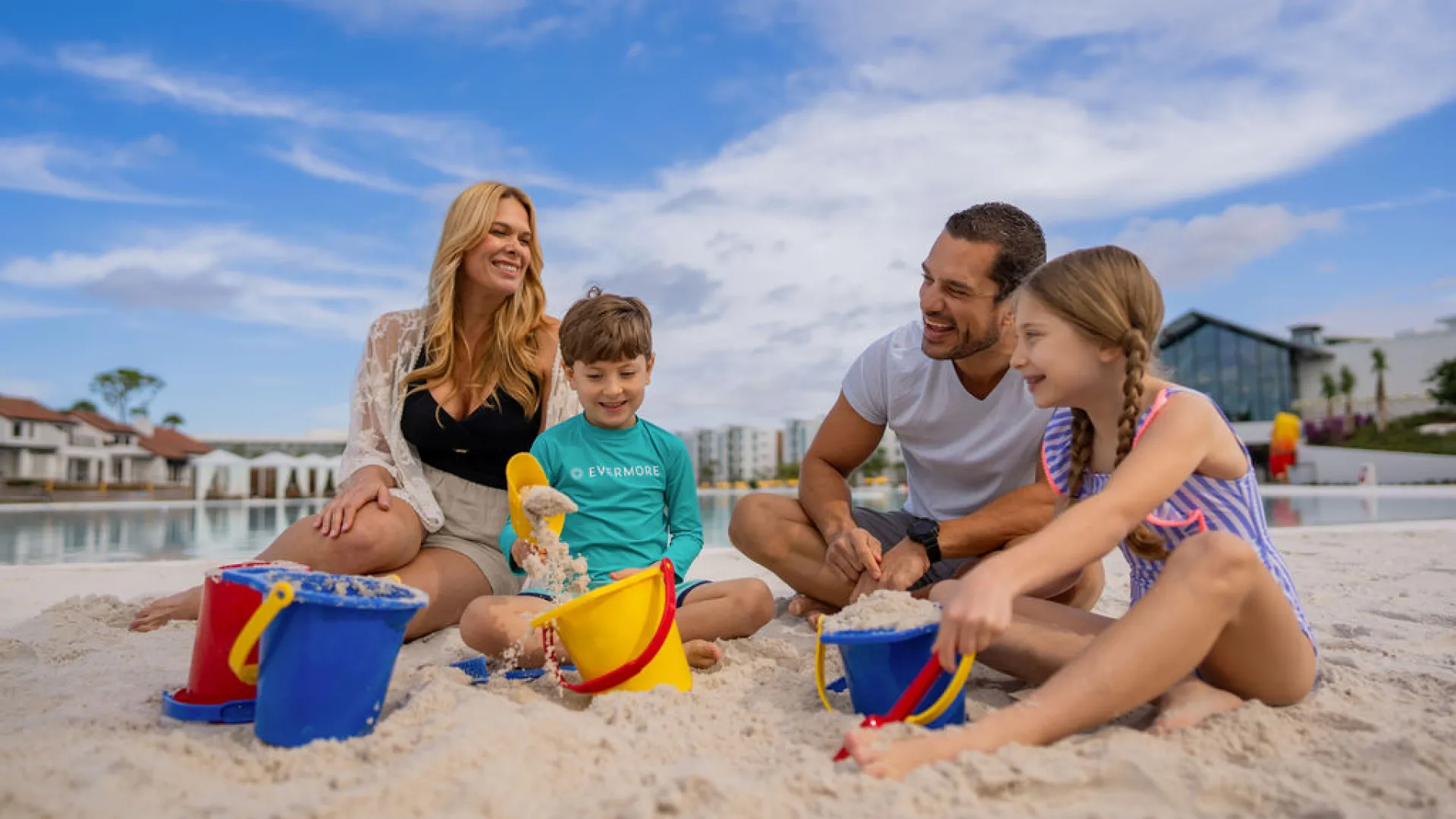Family playing in the sand