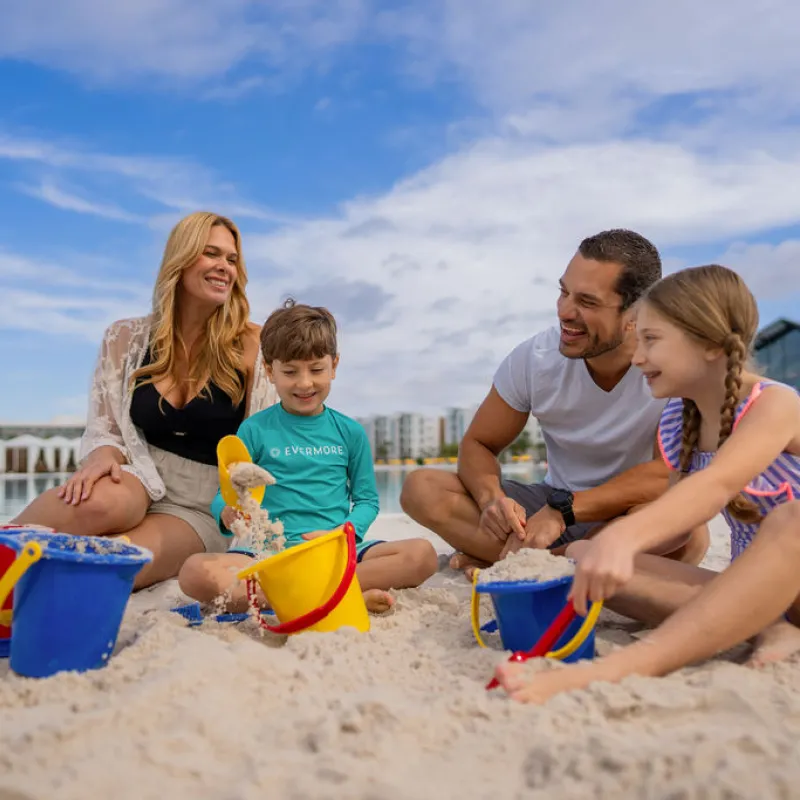 Family playing in the sand Family playing in the sand