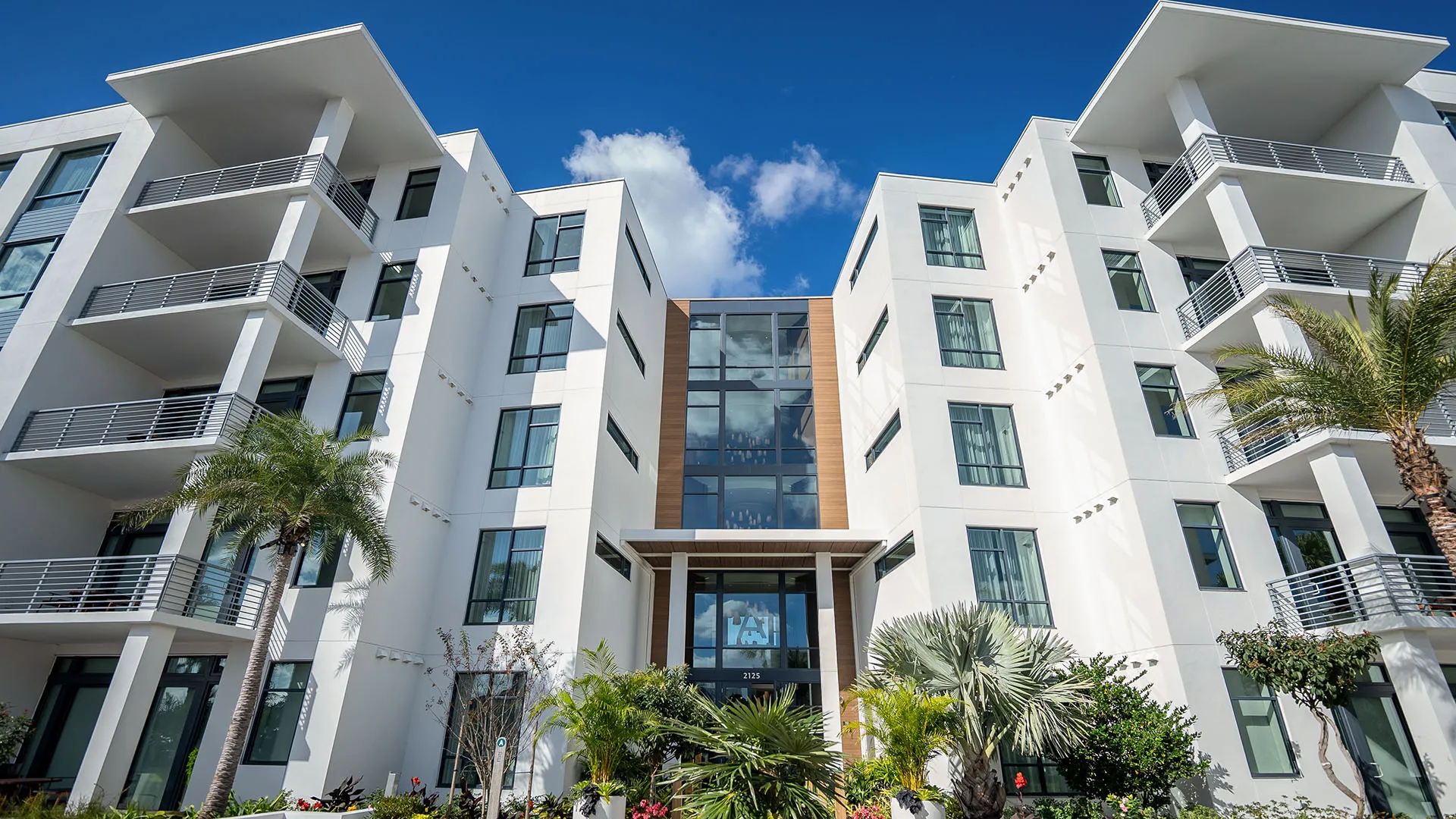 5-Story Tower Flats An image of the exterior of the 5-Story Tower Flats from the boardwalk at Evermore Orlando Resort.