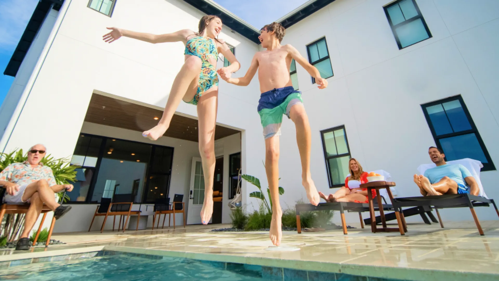 Kids Jumping in pool house - Hero