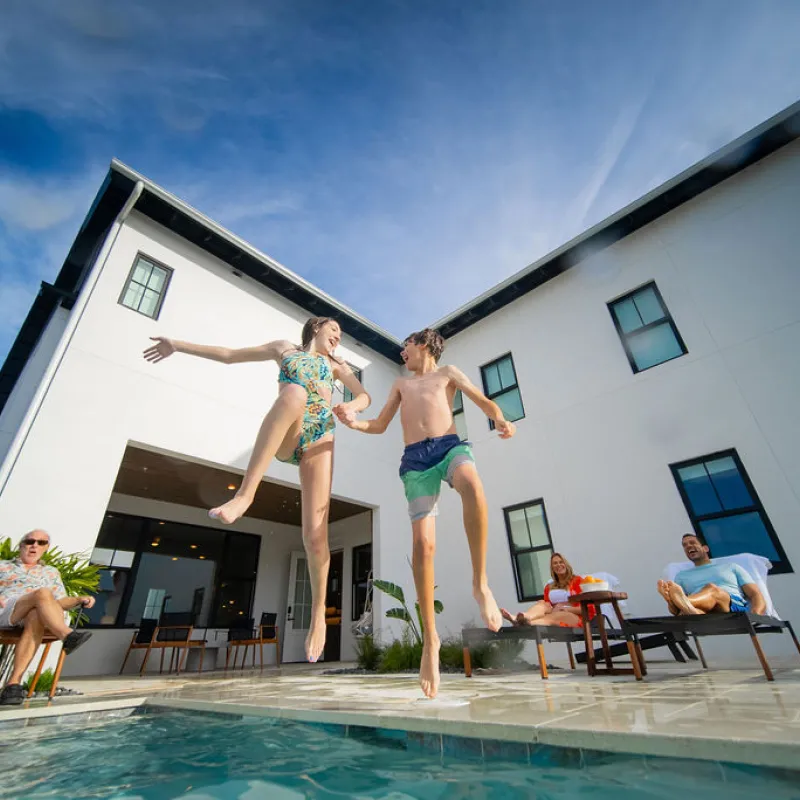 Kids jumping in pool
