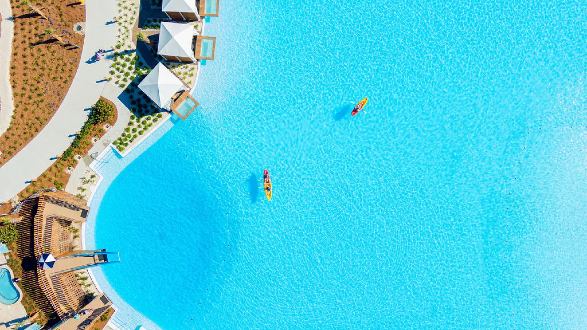 Aerial Bay View of Kayakers & Cabanas