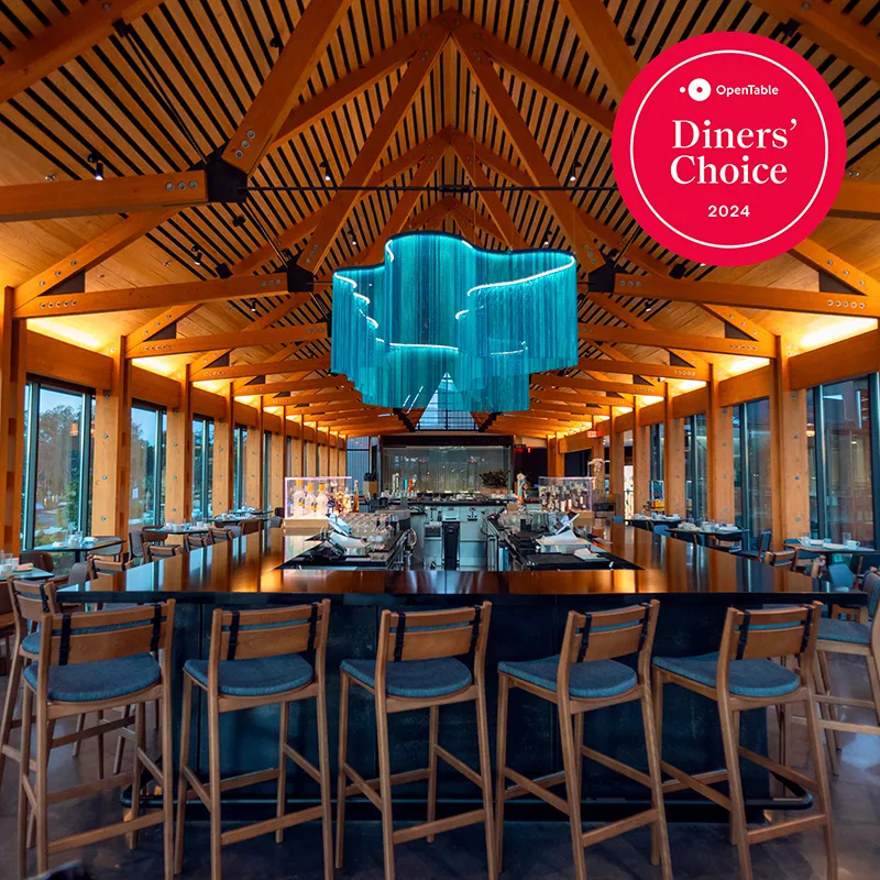 Twin View OpenTable Diners' Choice Award An image of the interior of Twin View Restaurant and Bar at Evermore Orlando Resort. Winner of an OpenTable Diners' Choice Award for 2024.