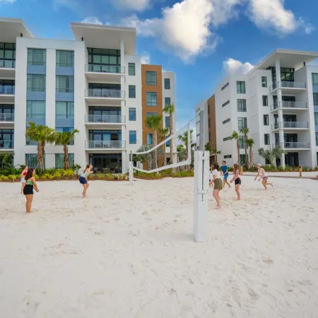 Friends playing volleyball
