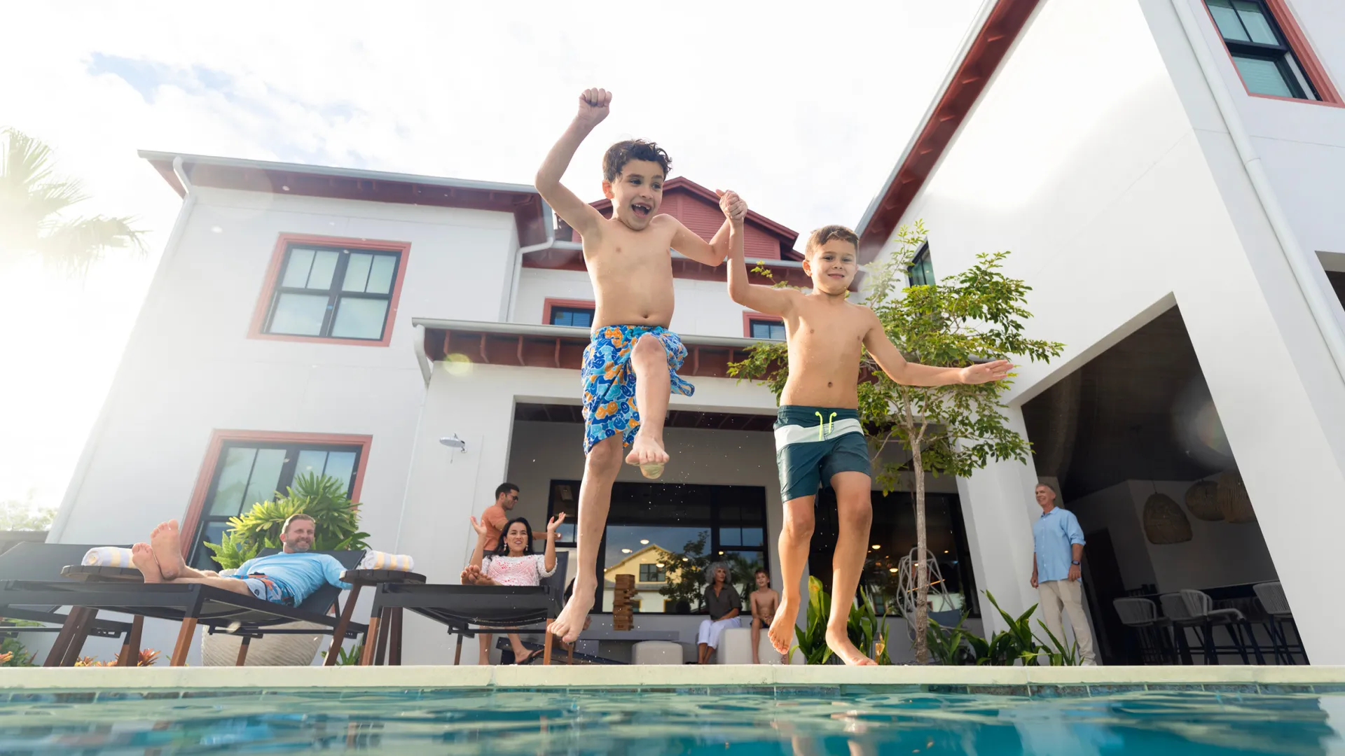 Kids Jumping into Private Heated Pool Image of kids jumping into the private heated pool in the backyard of a vacation home at Evermore Orlando Resort.